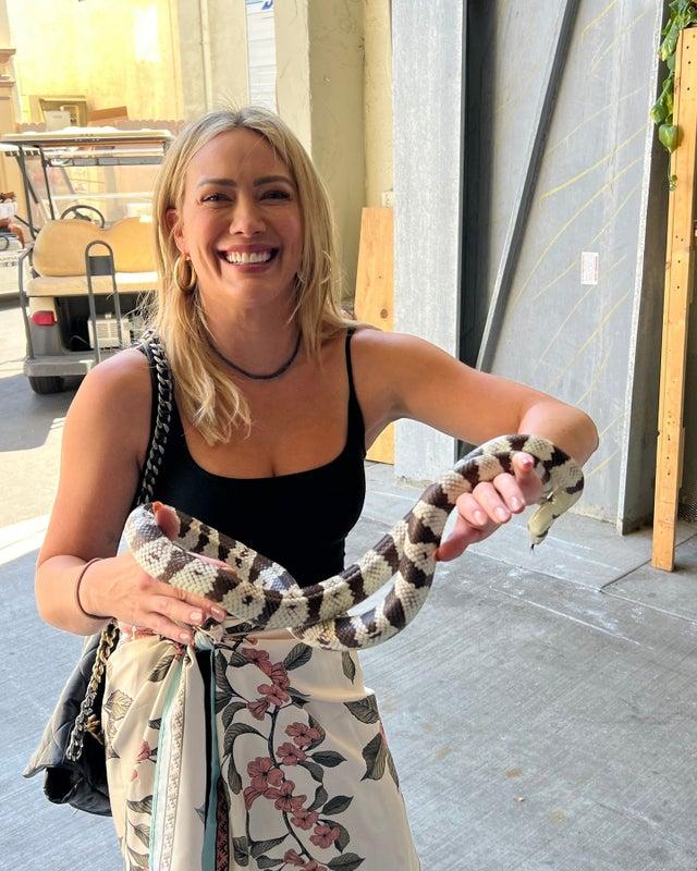 holding a snake