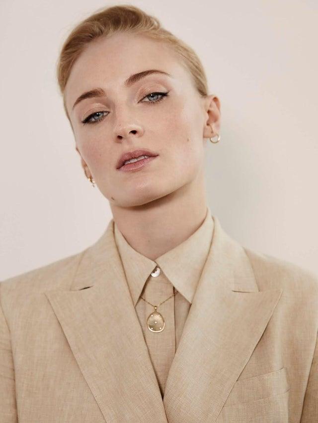 sophie in a suit pulling off the david bowie look